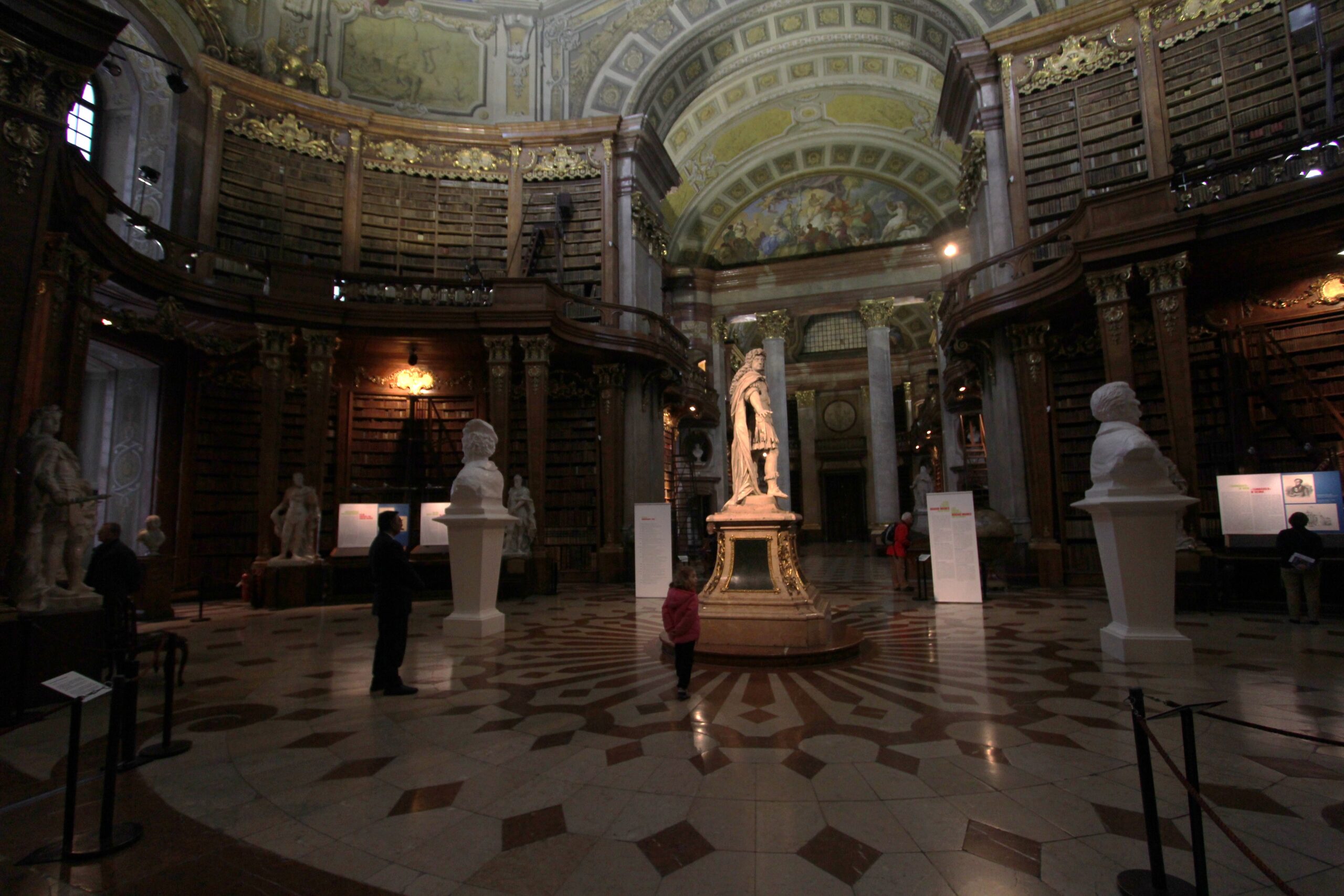 The marble statue of Charles VI under the dome of the State Hall, surrounded by statues and a patterned marble floor