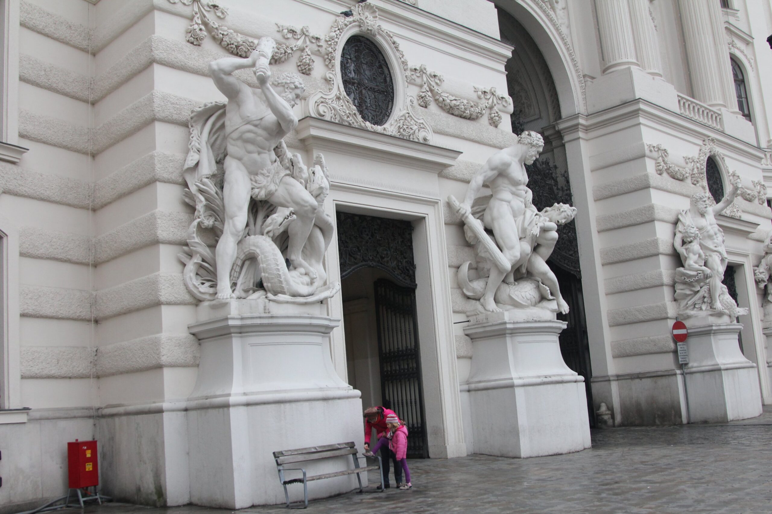 Marble Hercules statue groups flanking the gateways of the Michaelertor at the Hofburg in Vienna