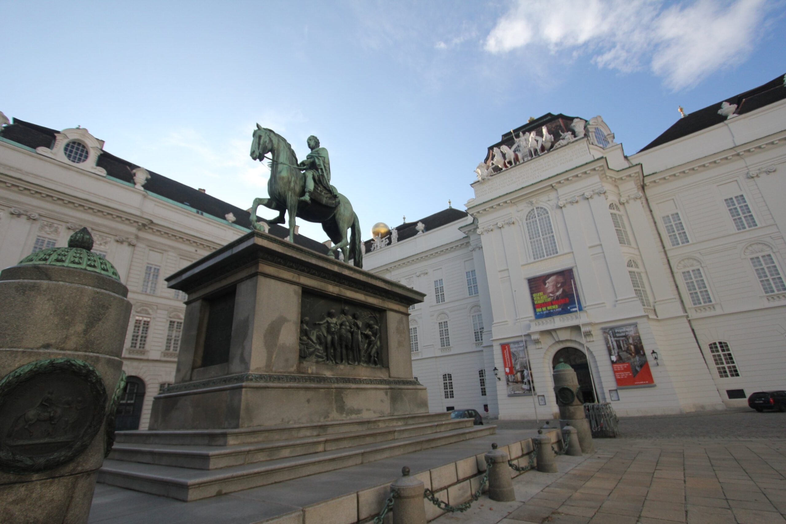 The bronze equestrian statue of Emperor Joseph II on Josefsplatz in Vienna, in front of the white Baroque front of the Austrian National Library and its State Hall